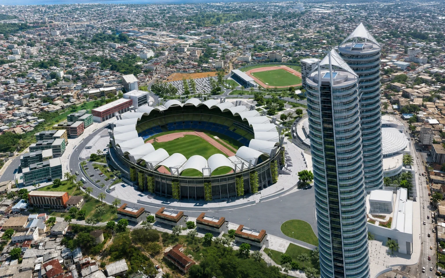 Veduta aerea di uno stadio e torri moderne nel tessuto urbano di Libreville